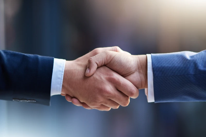 Cropped shot of two businessmen shaking hands